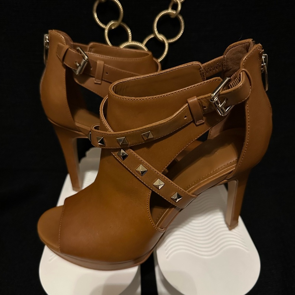 Marc Fisher bootie with gold hardware and studs.